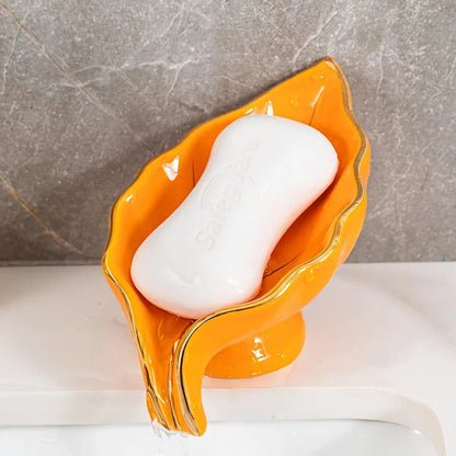 Elegant ceramic leaf-shaped soap dish with a heart design, perfect for adding a touch of nature-inspired luxury to your bathroom decor