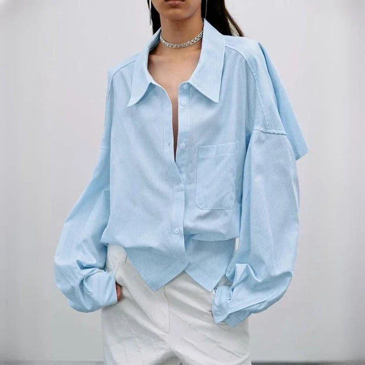 Chic patchwork blouse with functional pockets, perfect for casual and semi-formal occasions