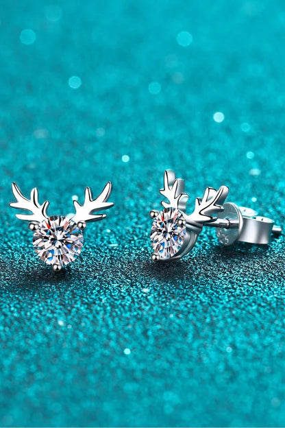 A modern, minimalist ring in sterling silver featuring a reindeer-inspired design with a sparkling moissanite stone.