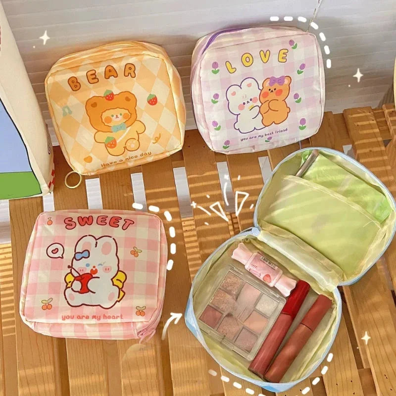 Adorable cartoon nylon cosmetic bag with secure zipper closure and compact, box-shaped design