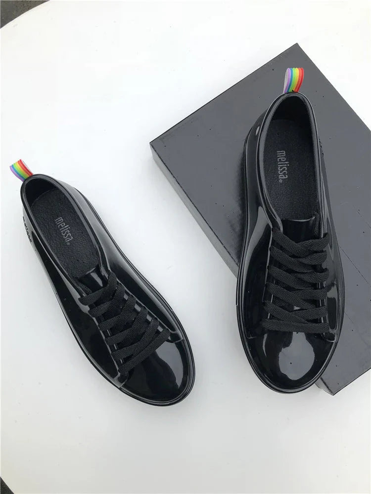 Premium lace-up sneakers for women with stylish flat design in black color