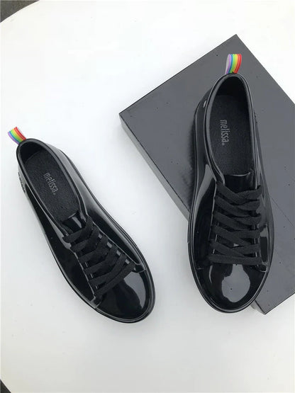 Premium lace-up sneakers for women with stylish flat design in black color