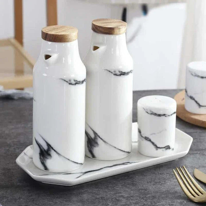 Elegant ceramic salt and pepper oil bottle set with wooden lids, perfect for storing and displaying seasonings and cooking oils in a modern kitchen