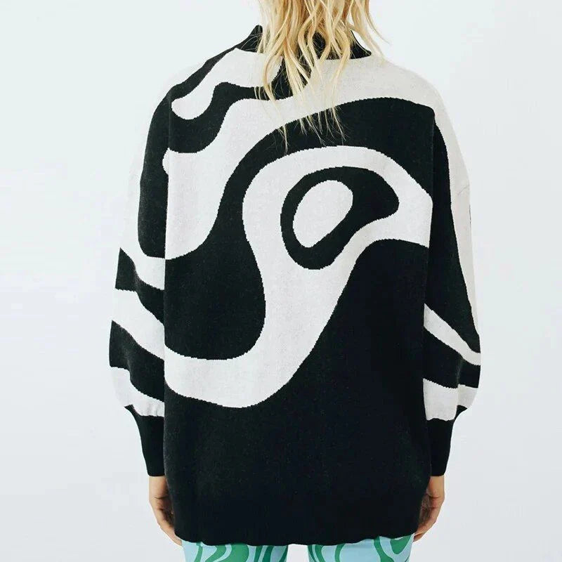 A woman wearing a stylish, striped turtleneck oversized sweater in a relaxed, comfortable fit.