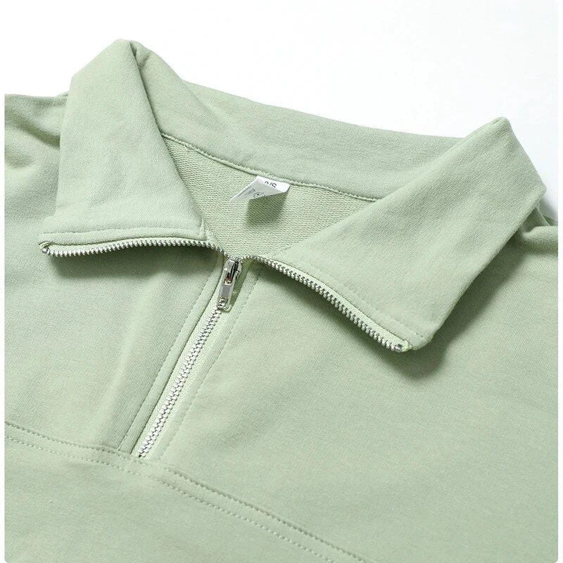 Cozy cotton pullover with zipper detail, available in purple, black, and gray colors