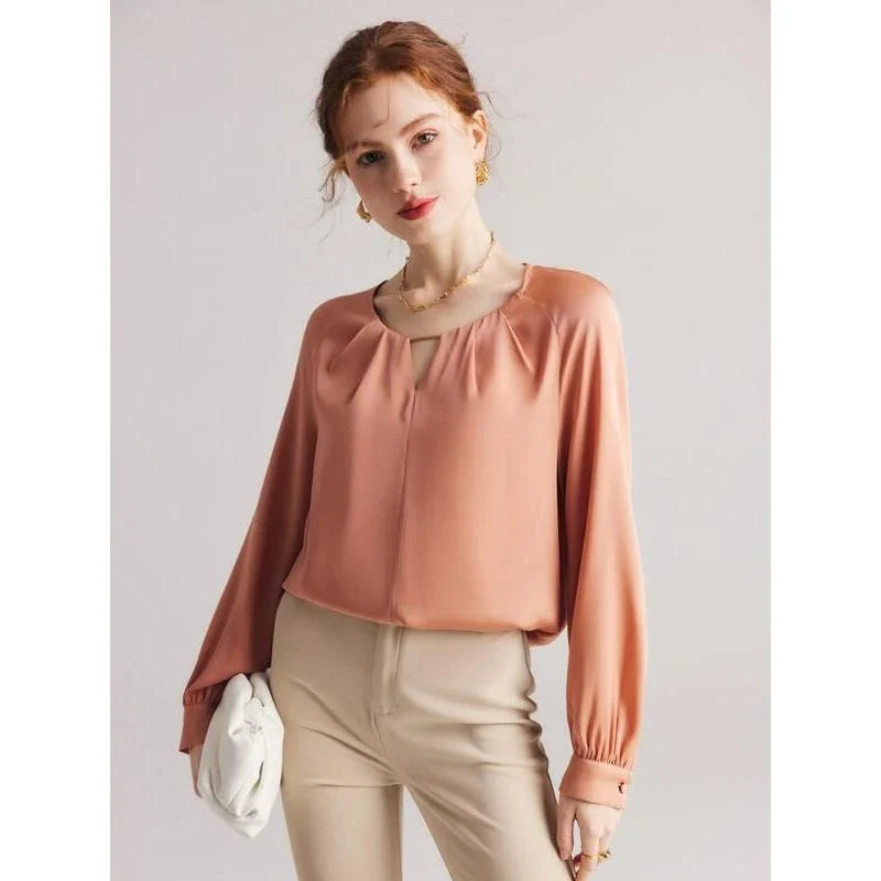 Elegant silk blend raglan sleeve blouse with timeless design and flattering fit for modern women