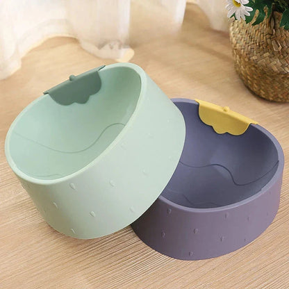 Cartoon-style pet bowl with anti-slip base, designed to provide comfort and reduce mess during mealtime for dogs and cats.