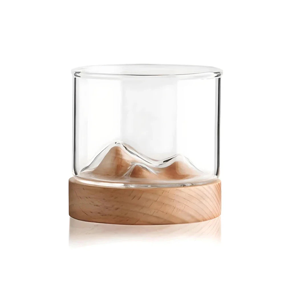 Elegant mountain-inspired whiskey glass with a wooden base, perfect for enjoying a variety of hot and cold beverages