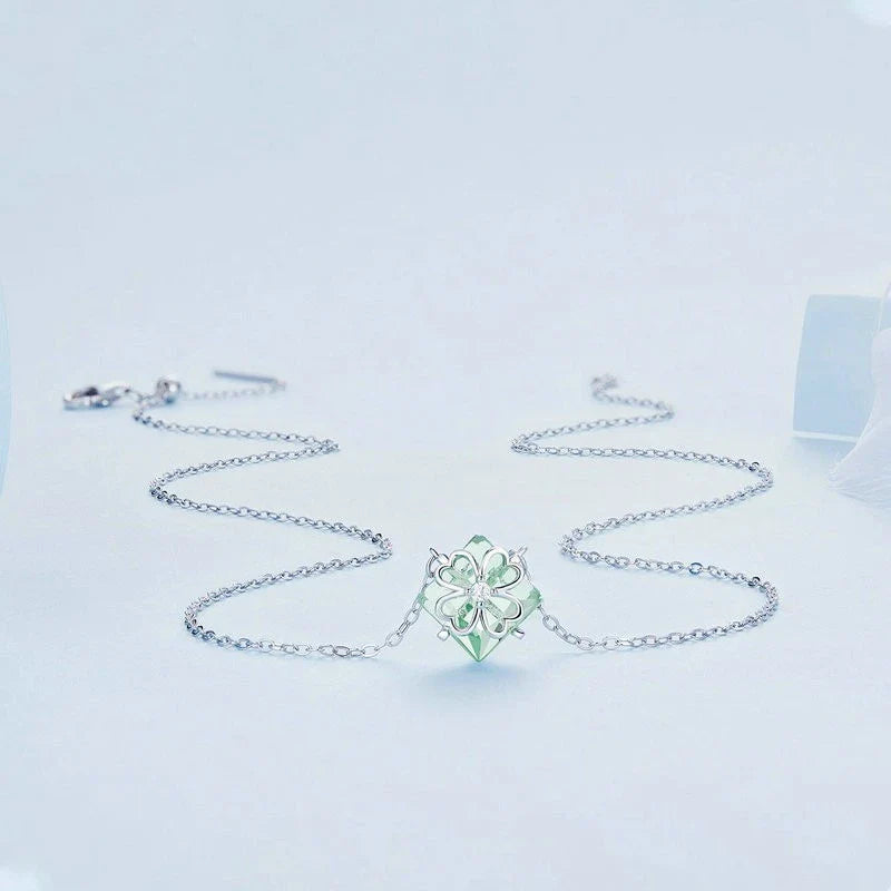 Elegant platinum-plated adjustable green pendant necklace with a sleek, silver-toned chain and a stylish green pendant