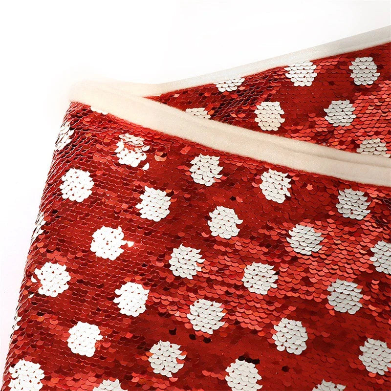 Festive Christmas tree skirt with red and white polka dot pattern and shimmering sequins