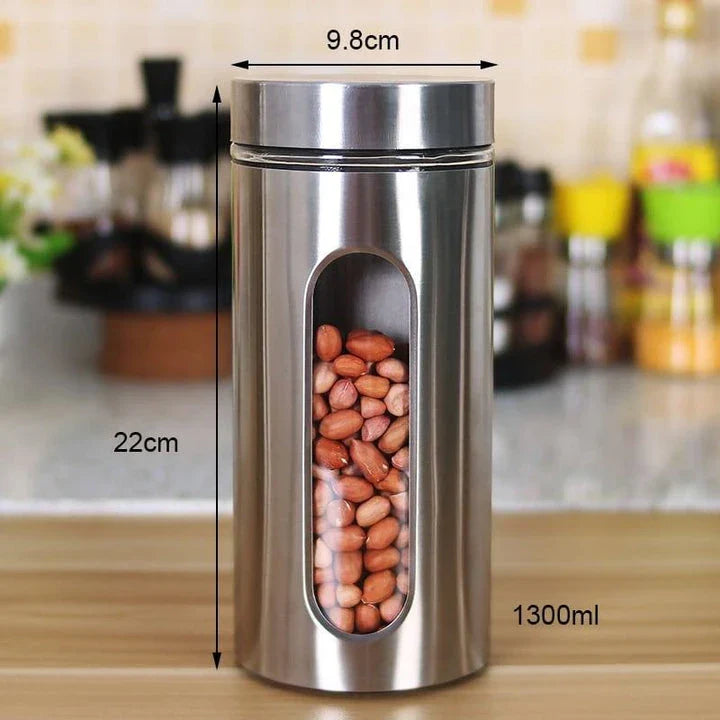Stainless steel and glass spice jars in various sizes with airtight lids, perfect for organizing and preserving spices in a modern kitchen.