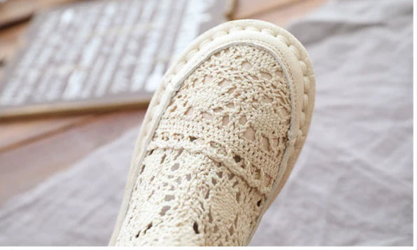 Flat-soled women's Martin boots in grey and beige colors, featuring a denim upper and rubber sole for comfortable, everyday wear.