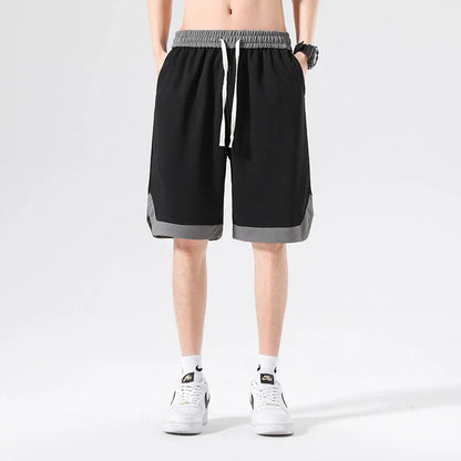 Men's loose and comfortable sports pirate shorts in white, gray, and black colors with elasticized waistband and relaxed fit