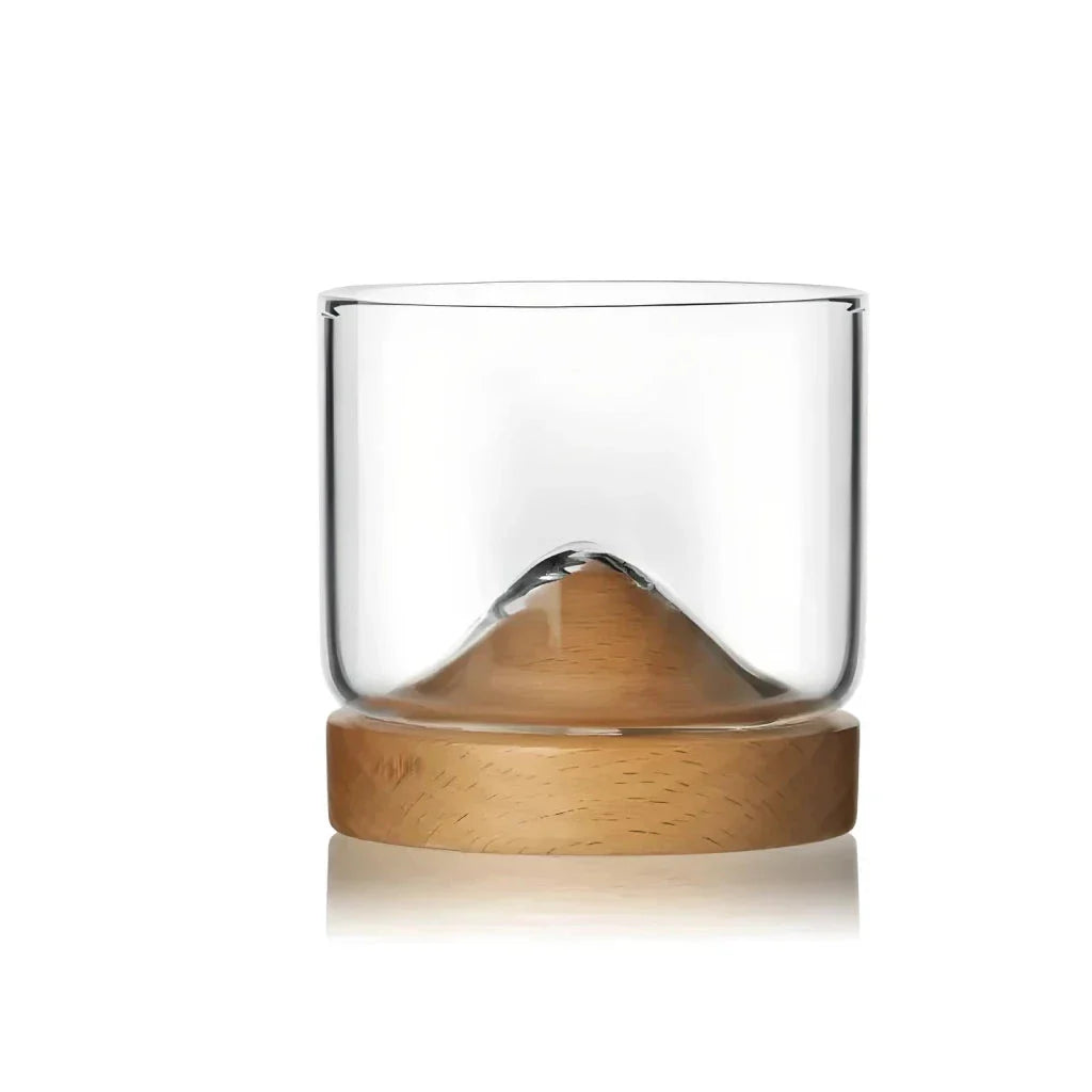 Elegant mountain-inspired whiskey glass with a wooden base, perfect for enjoying a variety of hot and cold beverages