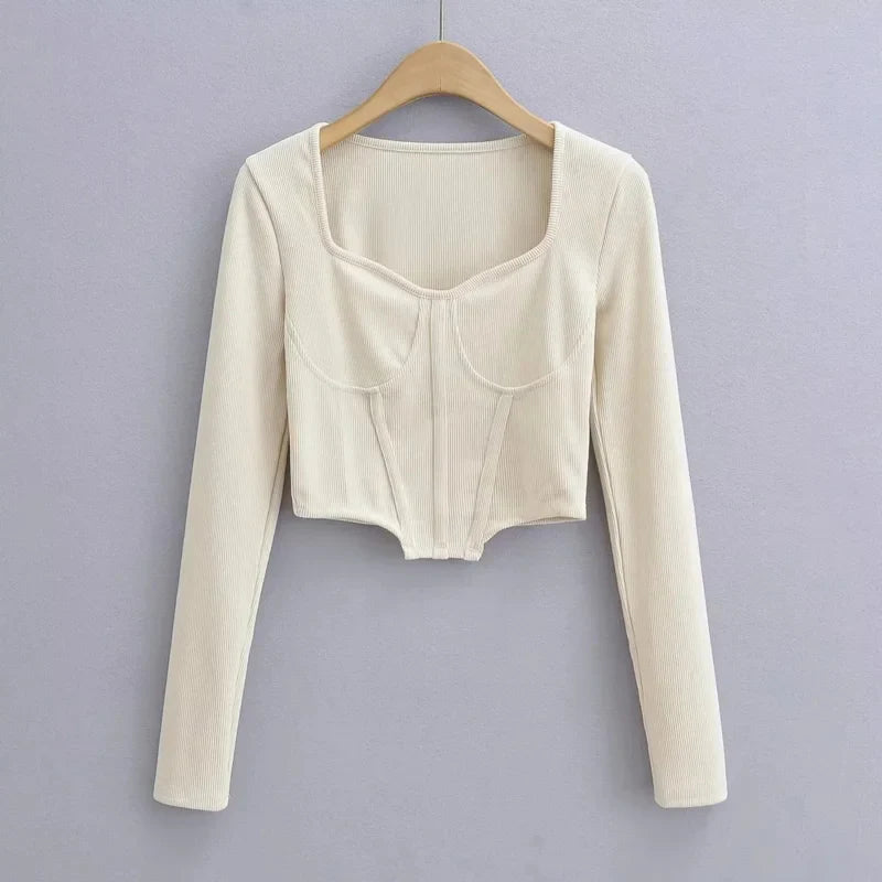 A stylish slim-fit short autumn top with an open waist design, made of premium polyester fabric with long sleeves and a square collar.