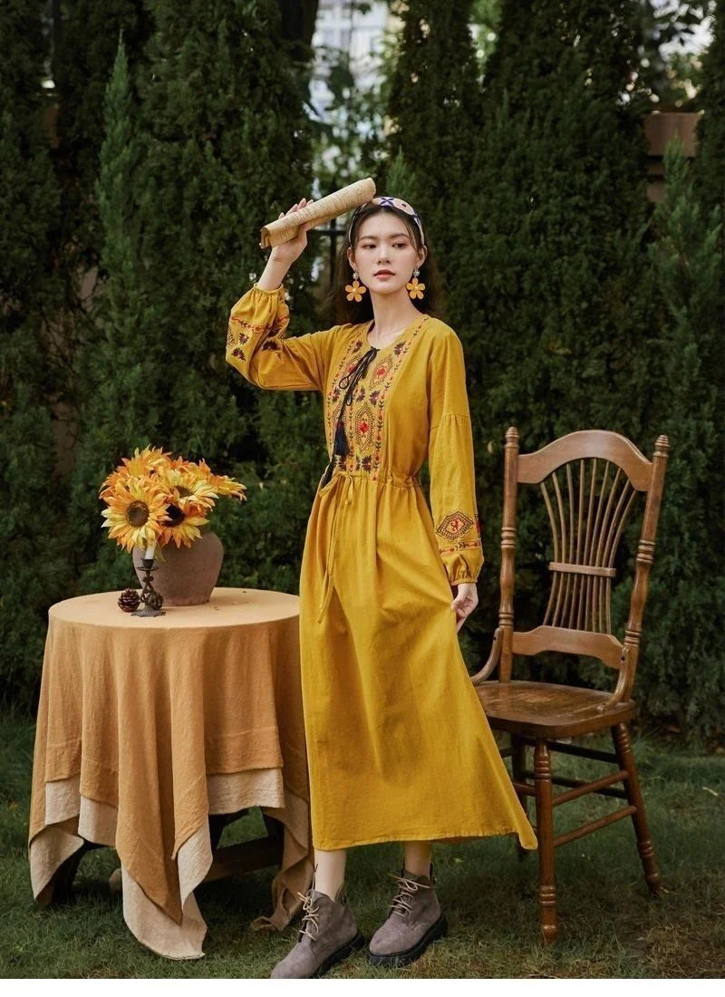 Elegant embroidered cotton-linen dress with tassels, featuring a waist-cinching A-line silhouette in vibrant colors