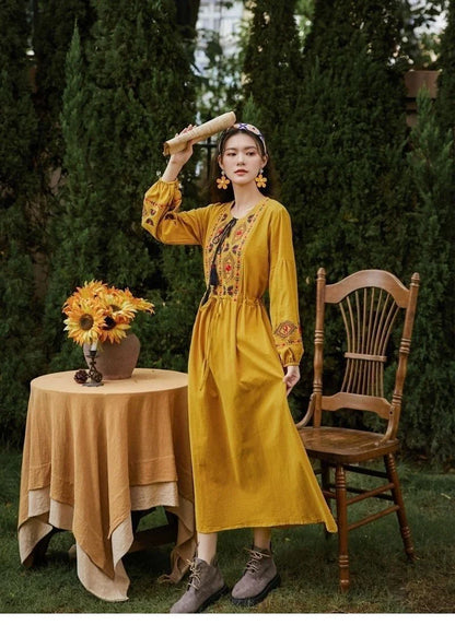 Elegant embroidered cotton-linen dress with tassels, featuring a waist-cinching A-line silhouette in vibrant colors