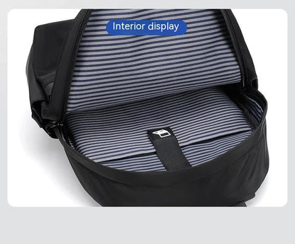 A large, simple, and stylish backpack made of durable nylon material with multiple compartments for organized storage and comfortable shoulder straps for easy carry.