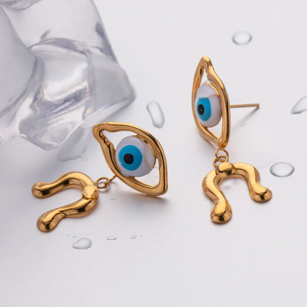 Pair of 18K gold plated stainless steel asymmetrical devil's eye earrings with a dripping oil finish