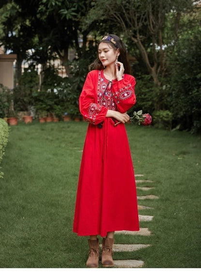 Elegant embroidered cotton-linen dress with tassels, featuring a waist-cinching A-line silhouette in vibrant colors