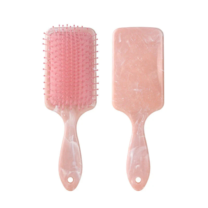 Marble Air Cushion Scalp Massage Hairbrush with air cushion technology for a soothing scalp massage and smooth, frizz-free hair