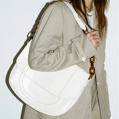 Stylish personalized acrylic chain shoulder bag in a creamywhite color, featuring a versatile tote design with a large capacity interior.