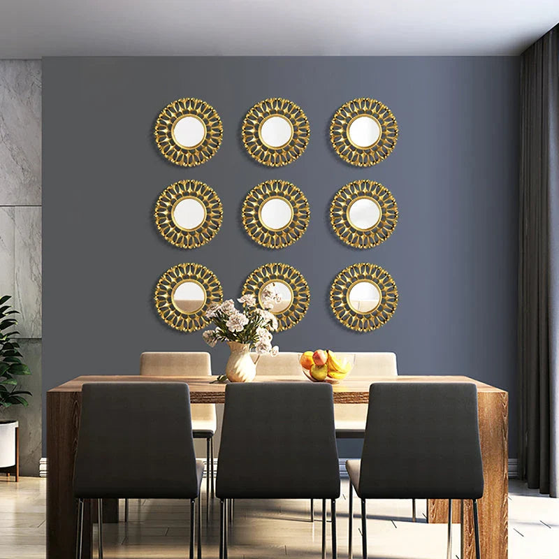 Elegant gold floral wall mirror with round design and metal frame, perfect for home decor