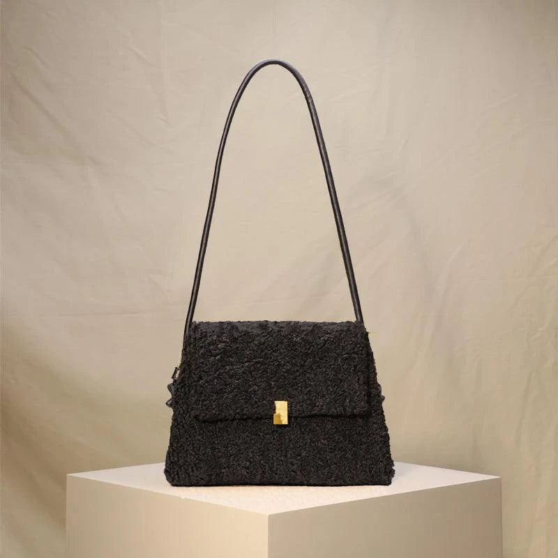 Stylish faux lamb wool crossbody shoulder bag in neutral colors with a cozy, plush exterior and organized interior pockets