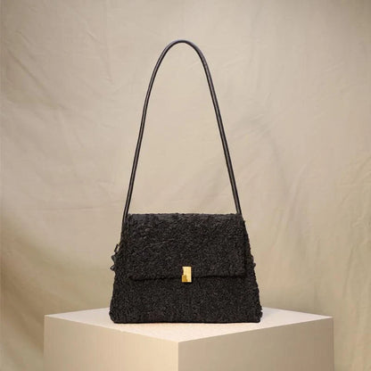 Stylish faux lamb wool crossbody shoulder bag in neutral colors with a cozy, plush exterior and organized interior pockets