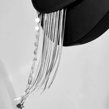 Premium leather crossbody saddle bag with stylish tassel detail, perfect for everyday use or formal occasions.
