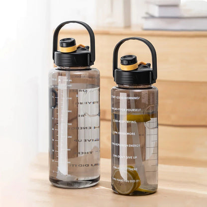 A large capacity sports water bottle with a straw lid and time stamps, designed for ultimate hydration and convenience.
