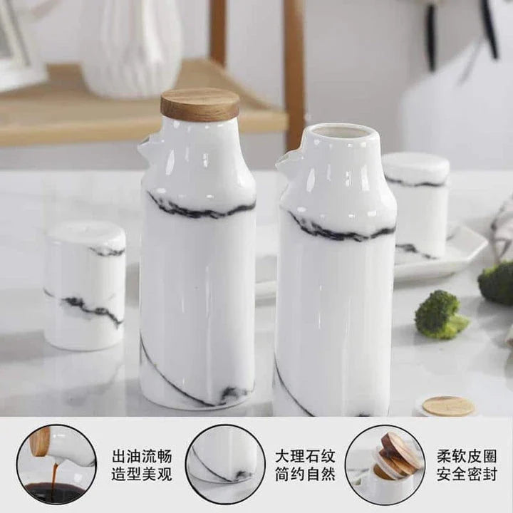 Elegant ceramic salt and pepper oil bottle set with wooden lids, perfect for storing and displaying seasonings and cooking oils in a modern kitchen