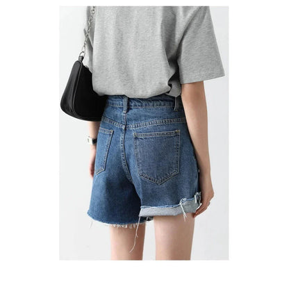 Women's Retro Blue High-Waisted Denim Shorts with Irregularly Cut Design and Cuff Details