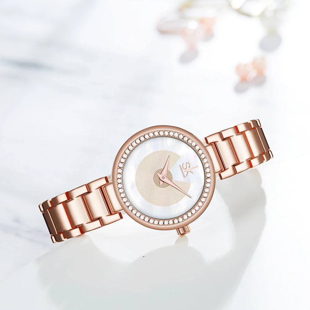 A fashionable stainless steel women's watch with diamond accents, waterproof design, and a modern quartz movement.