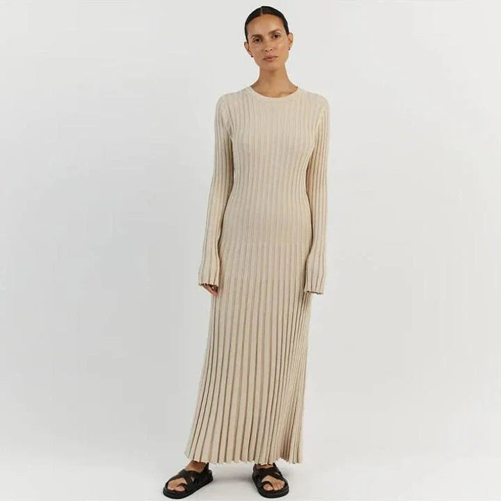 Timeless elegant pleated knit dress in black, perfect for summer office wear with a sophisticated and comfortable design.