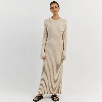Timeless elegant pleated knit dress in black, perfect for summer office wear with a sophisticated and comfortable design.