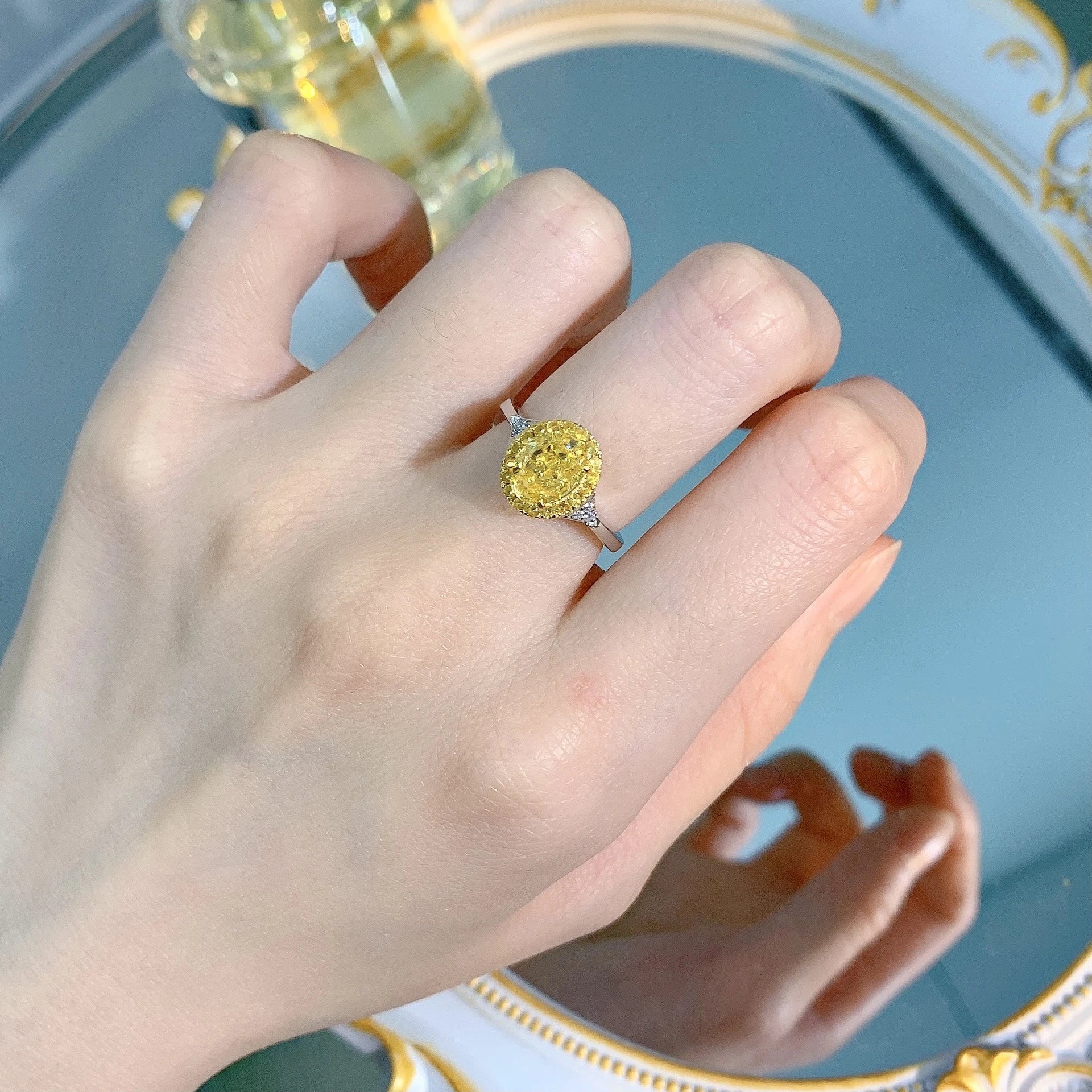 Elegant yellow diamond cocktail ring with a sleek, silver-toned band and a regal crown-shaped setting