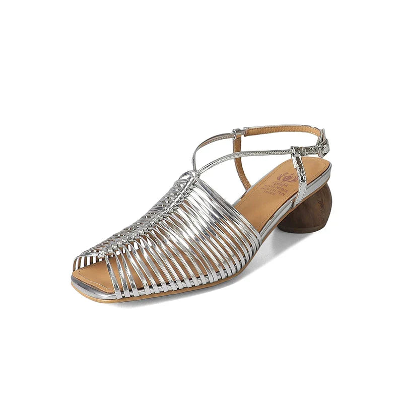 Stylish high heel genuine leather sandals in silver color with ankle strap and fashionable buckle closure