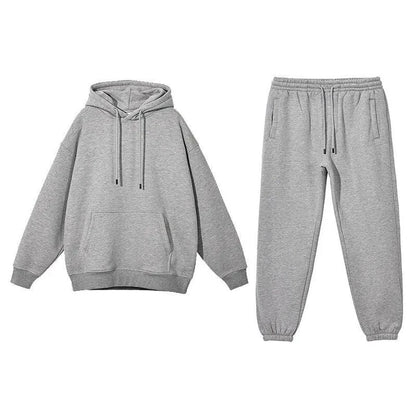 Cozy Fleece Hoodie and Sweatpants Set in Light Pink, featuring a relaxed fit and hooded design for maximum comfort and style.