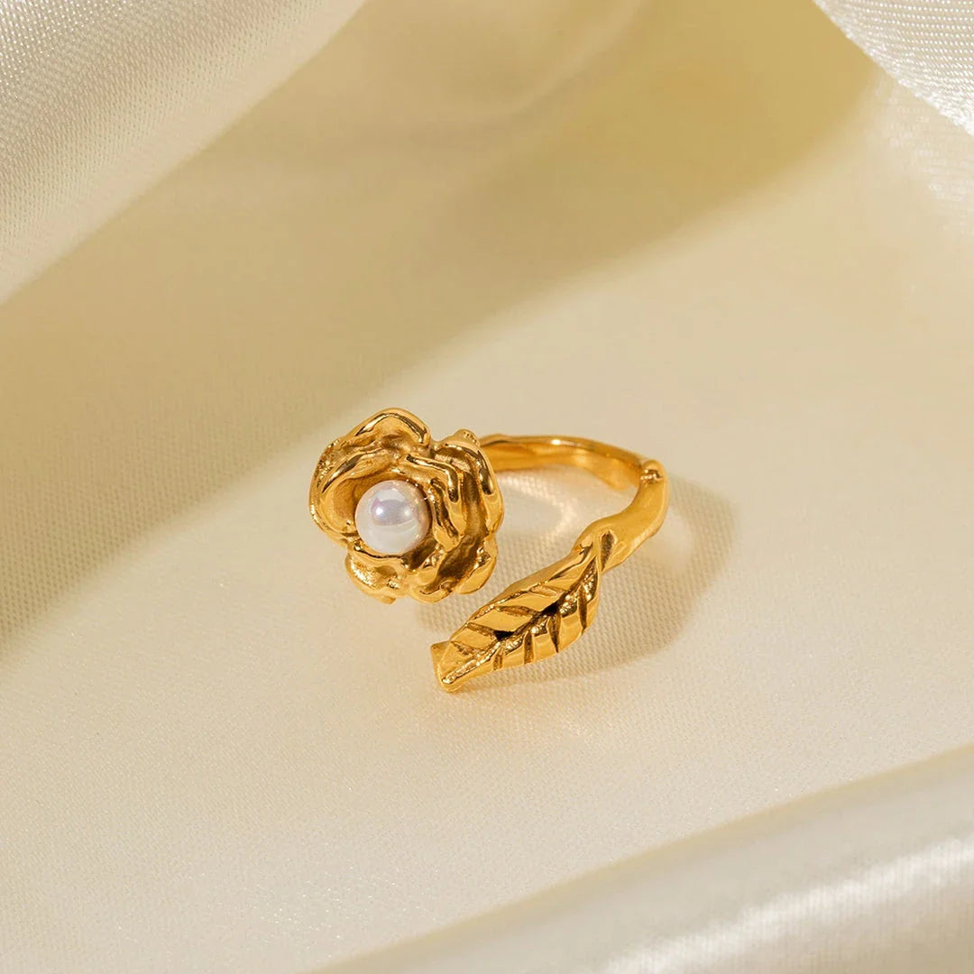 Gold stainless steel camellia ring with shellfish beads, a timeless and elegant accessory for any occasion.