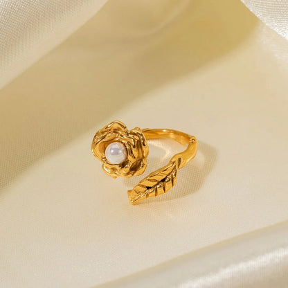 Gold stainless steel camellia ring with shellfish beads, a timeless and elegant accessory for any occasion.