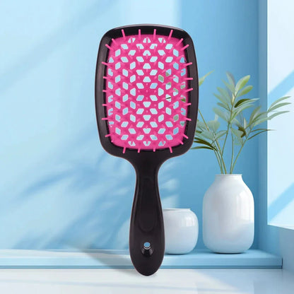 DetanglePro Air Cushion Hair Comb in purple, pink, and green colors for effortless hair detangling