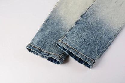 American High Street fashionable men's ripped black and white patch jeans in a light blue denim color