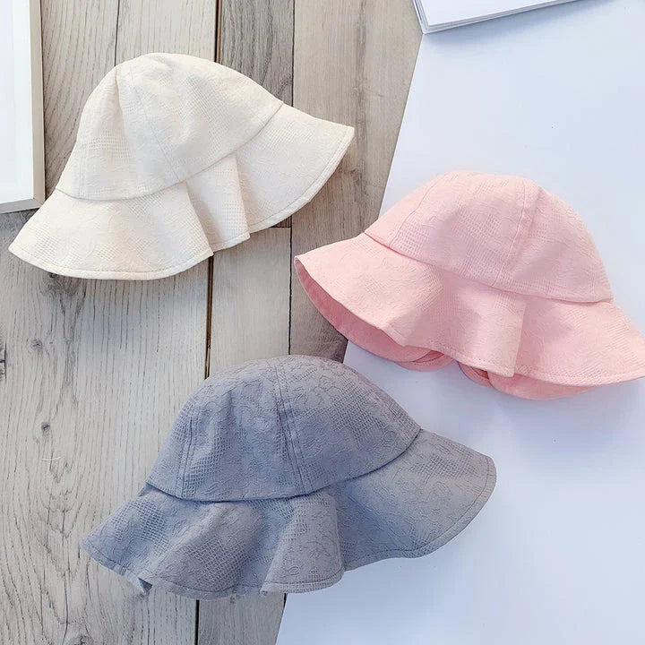 Adorable princess-inspired baby bucket hat with soft cotton material and wide brim for sun protection