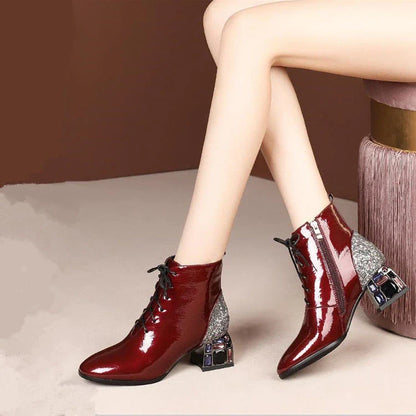 Elegant patent leather pumps with rhinestone embellishments and thick, high heels