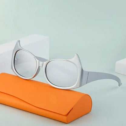 Stylish cat-eye sunglasses with oversized frames, semi-rimless design, and punk-inspired detailing for a timeless, glamorous look
