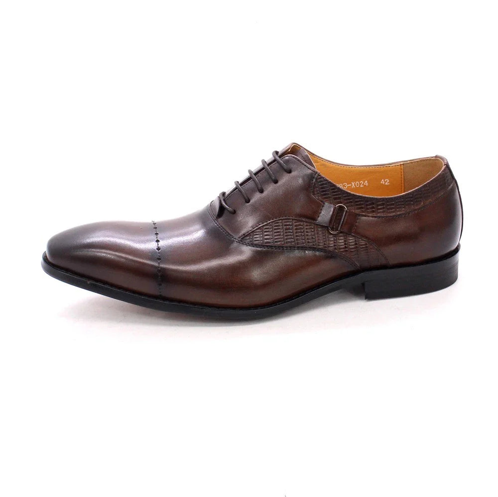 Premium handcrafted leather oxfords in brown with a pointed toe design, suitable for business and formal occasions.