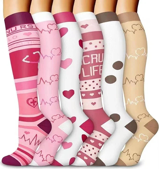 Pairs of long tube compression sports socks in a variety of stylish color combinations