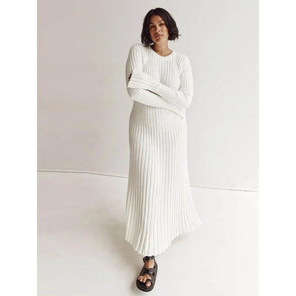 Timeless elegant pleated knit dress in black, perfect for summer office wear with a sophisticated and comfortable design.