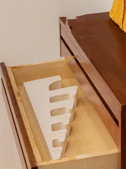 Intricate origami-style paper Christmas tree decoration in a modern, minimalist design